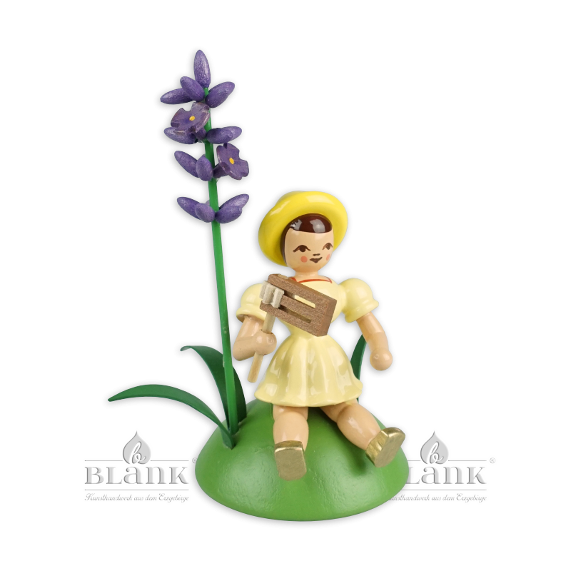 Blumenkind sitzend -  farbig Lavendel/Ratsche Faltenrock - BKS 036