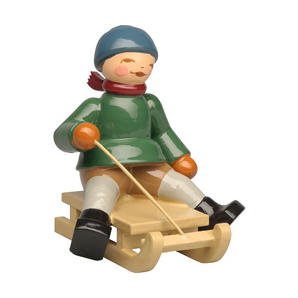 Junge auf Schlitten => ab Oktober 2026