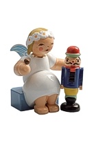 kleiner Wendt und Kühn Margeritenengel - sitzend mit Nussknacker und Nuss kleiner Wendt und Kühn Margeritenengel - sitzend mit Nussknacker und Nuss